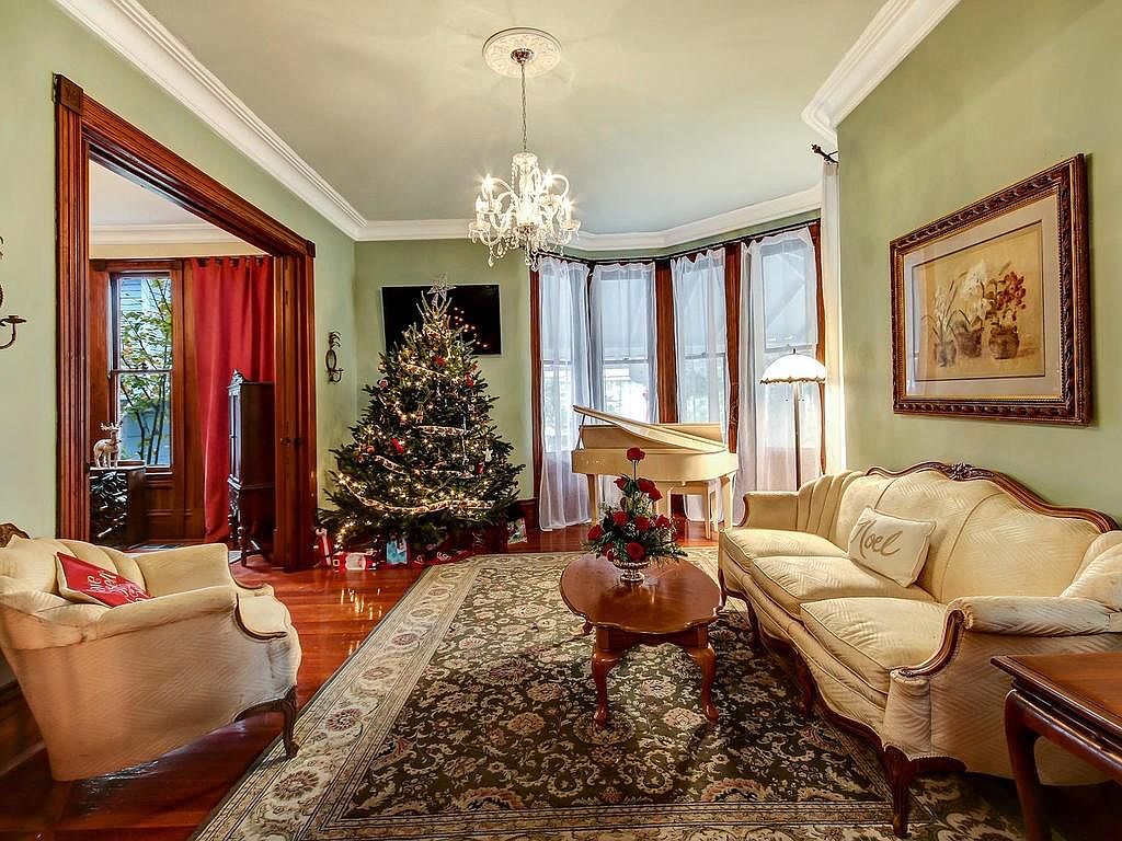 Front parlor with heart pine floors, chandelier, and period furnishings